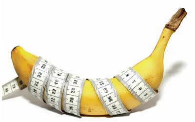 penile girth enhancement display on Banana wrapped with measuring tape symbolizing weight or size measurement